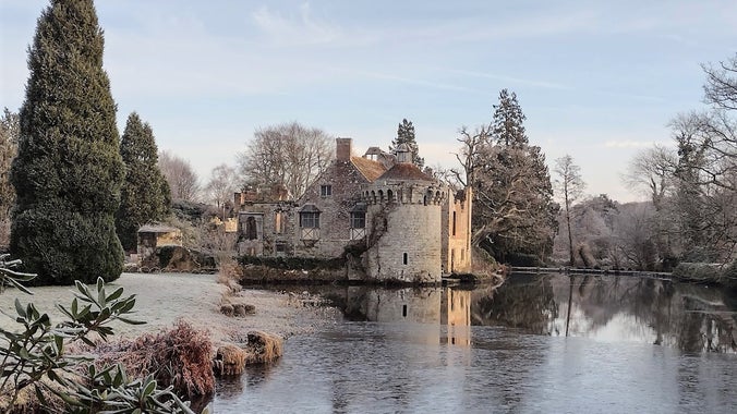 A frosty Scotney Castle viewed across the moat from the Chinese Bridge